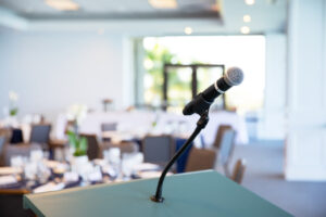 A microphone and podium set up in the New Pass Room.